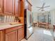 The kitchen features stainless steel appliances, stone countertops, recessed lighting and a dining area at 5323 73Rd N St, St Petersburg, FL 33709