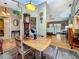 Living area with a grandfather clock and a view of the kitchen and front entryway at 5323 73Rd N St, St Petersburg, FL 33709