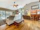 Spacious living room with hardwood floors, plush seating, and seamless access to the pool and patio at 5323 73Rd N St, St Petersburg, FL 33709