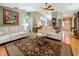 Spacious living room offers hardwood floors and a view into multiple rooms and the front entrance at 5323 73Rd N St, St Petersburg, FL 33709