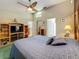 Spacious main bedroom with ceiling fan, open doors to other rooms and ensuite bath at 5323 73Rd N St, St Petersburg, FL 33709