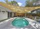 Backyard features a pool and patio seating, perfect for outdoor entertaining and relaxing at 5323 73Rd N St, St Petersburg, FL 33709