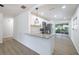 Modern kitchen with granite countertops, stainless steel appliances, and stylish pendant lighting at 6304 S S Grady Ave, Tampa, FL 33616