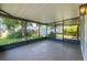 Screened lanai with tiled floors offers a relaxing outdoor space at 6304 S S Grady Ave, Tampa, FL 33616