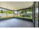 Screened lanai with tiled floors offers a relaxing outdoor space at 6304 S S Grady Ave, Tampa, FL 33616