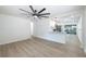 Open-concept living room flowing into a modern kitchen with stainless steel appliances at 6304 S S Grady Ave, Tampa, FL 33616