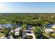 Aerial view of a charming home nestled among lush greenery and waterways at 6814 68Th E Ave, Bradenton, FL 34203