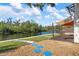 Landscaped backyard featuring a patio area and waterfront view on a sunny day at 6814 68Th E Ave, Bradenton, FL 34203