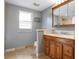 Cozy bathroom with a vanity, tiled floors, a shower, and a window for natural light at 6814 68Th E Ave, Bradenton, FL 34203