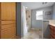 Well-lit bathroom featuring a shower, vanity, cabinet, and large window for natural light at 6814 68Th E Ave, Bradenton, FL 34203