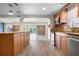 Charming kitchen featuring wood cabinets, stainless steel appliances, and an open floor plan at 6814 68Th E Ave, Bradenton, FL 34203