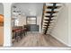 Modern living room with wood floors, open staircase and bar seating in the background at 6814 68Th E Ave, Bradenton, FL 34203