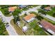 Single Gathering home featuring a fenced in back yard and two storage sheds on a large corner lot at 8445 Angela Ct, Zephyrhills, FL 33541