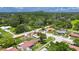 Desirable single-story home featuring a large yard, storage shed, mature trees, and quiet neighborhood at 8445 Angela Ct, Zephyrhills, FL 33541