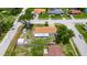 This single-Gathering home has a well-maintained lawn with two sheds and is located on a spacious corner lot at 8445 Angela Ct, Zephyrhills, FL 33541