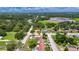 Charming single-story home with mature trees in a tranquil neighborhood with a spacious, well-maintained yard at 8445 Angela Ct, Zephyrhills, FL 33541