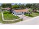 Well-maintained single-story home with a two-car garage and a manicured lawn at 8445 Angela Ct, Zephyrhills, FL 33541