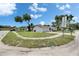 Well-maintained single-story home with attached garage and a spacious yard at 8445 Angela Ct, Zephyrhills, FL 33541