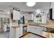 Clean kitchen with stainless steel appliances and wood countertops, with a view of the dining area at 8445 Angela Ct, Zephyrhills, FL 33541