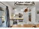 Bright kitchen and bar area featuring wood countertops and stainless steel appliances at 8445 Angela Ct, Zephyrhills, FL 33541