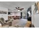 Spacious living room with cozy seating area, ceiling fan and screened patio access at 8445 Angela Ct, Zephyrhills, FL 33541