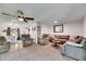 Bright living room featuring cozy seating area and an open concept layout at 8445 Angela Ct, Zephyrhills, FL 33541