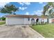Charming covered porch with decorative columns and a tiled floor at 8445 Angela Ct, Zephyrhills, FL 33541
