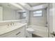 Bright bathroom featuring a marble vanity, and a shower-tub combination with gray subway tile and new fixtures at 9011 Hunt Club Ln, Port Richey, FL 34668