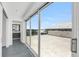 Large balcony with sliding glass doors, offering beautiful views of the water and surrounding area at 905 Bay Point Dr, Madeira Beach, FL 33708