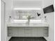 Modern bathroom with double vanity, stylish fixtures, and sleek design at 905 Bay Point Dr, Madeira Beach, FL 33708