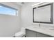 Bright bathroom with a modern vanity, large mirror, and open-concept design at 905 Bay Point Dr, Madeira Beach, FL 33708