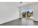 Modern bedroom with tile floors with sliding glass doors showcasing waterfront views at 905 Bay Point Dr, Madeira Beach, FL 33708