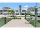 Private dock features boat lift and direct access to the water, complemented by luxurious home at 905 Bay Point Dr, Madeira Beach, FL 33708