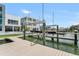 Dock with boat lift and stunning waterfront views, enhancing the appeal of a luxury waterfront property at 905 Bay Point Dr, Madeira Beach, FL 33708