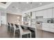 Modern kitchen featuring stainless steel appliances, quartz countertops, and seating at the island at 905 Bay Point Dr, Madeira Beach, FL 33708