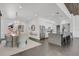 Open floor plan with modern kitchen, dining area, and living space with wood plank ceiling at 905 Bay Point Dr, Madeira Beach, FL 33708