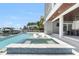 Backyard swimming pool and spa with dock and boat in the inter coastal waterway at 905 Bay Point Dr, Madeira Beach, FL 33708