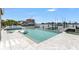 Backyard swimming pool and spa with dock and boat in the inter coastal waterway at 905 Bay Point Dr, Madeira Beach, FL 33708