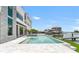 Backyard swimming pool and spa with dock and boat in the inter coastal waterway at 905 Bay Point Dr, Madeira Beach, FL 33708