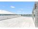 Spacious rooftop terrace with beautiful tile floors and waterfront views at 905 Bay Point Dr, Madeira Beach, FL 33708