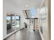 Modern staircase complemented by waterfront views and sleek design at 905 Bay Point Dr, Madeira Beach, FL 33708