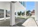 This covered outdoor area under the home provides parking and recreation space at 905 Bay Point Dr, Madeira Beach, FL 33708
