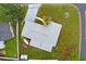 Aerial view of the property showing the house, roof, yard, and driveway at 9120 108Th St, Seminole, FL 33772