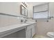 This bathroom features ample counter space, a mirror, and great natural light at 9120 108Th St, Seminole, FL 33772
