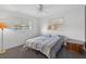 Bedroom features a large window for natural light and soft carpet flooring at 9120 108Th St, Seminole, FL 33772