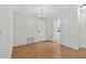 Bright dining room featuring hardwood floors, chandelier, and ample space for entertaining at 9120 108Th St, Seminole, FL 33772