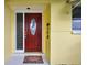 Inviting entryway featuring a red front door with decorative glass and a 'Welcome' mat at 9120 108Th St, Seminole, FL 33772