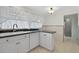 This kitchen offers ample counter space, natural light, and is equipped with a dishwasher at 9120 108Th St, Seminole, FL 33772