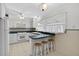 Bright kitchen featuring white cabinets, ample counter space, and tile flooring at 9120 108Th St, Seminole, FL 33772