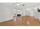 Spacious living room with hardwood floors and an adjoining sunroom, creating a seamless flow at 9120 108Th St, Seminole, FL 33772